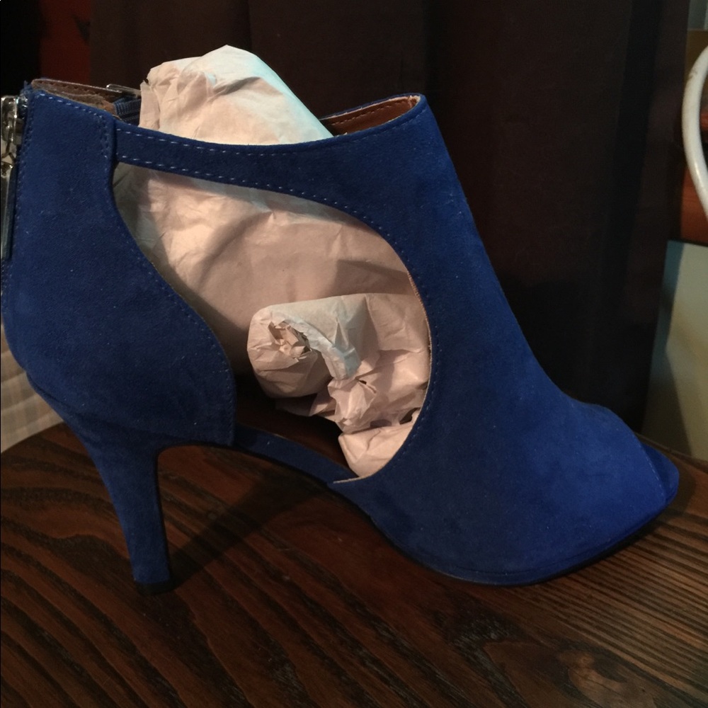 Open toed sandals with cutouts, 3” heels.